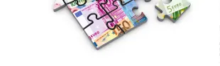 Immagine di una casa a forma di puzzle