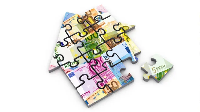 Immagine di una casa a forma di puzzle
