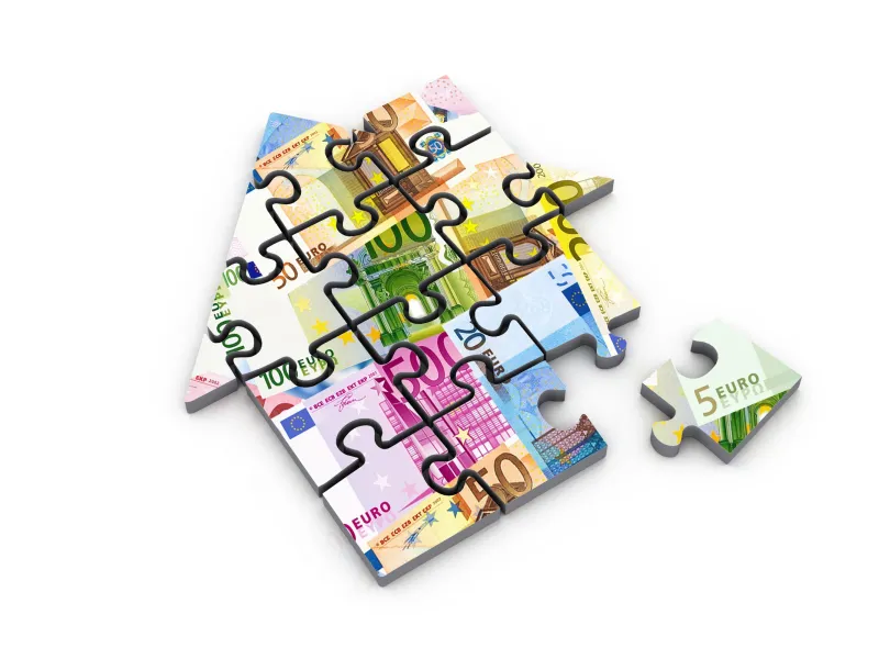 Immagine di una casa a forma di puzzle